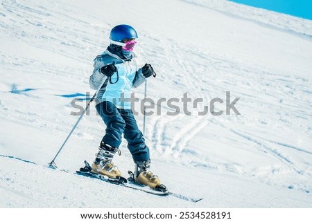 Image, Stock Photo happy child girl skiing in winter snowy forest