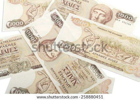 Old Greek currency of 1000 drachmas bills isolated on white.