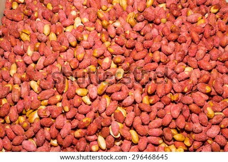 Health booster high protein high energy food roasted salted peanut seeds on an open air food market stand.