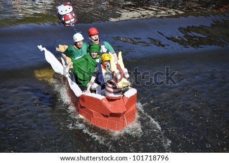 UPPSALA, SWEDEN - 30 APRIL: Unidentified people at the boat race. The official name is forsranning. Organizes are Uppsala technology and naturvetarkaren, at Uppsala, Sweden April 30, 2012.