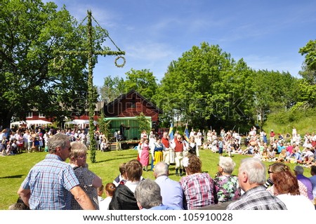 TORSTUNA, SWEDEN - June 19:  Unidentified people in folklore ensemble in traditional folk costume. The official name is midsummer event and org are hembygd Torstuna on June 22, 2012 in Torstuna Sweden