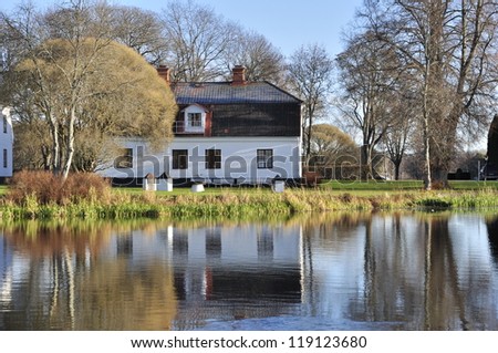 Charming cottages at the lakeside in autumn