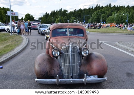 VASTERAS, SWEDEN - JULY 6: Unidentified people in power big meet cruising with old classic car.Official name is Power meet and organization are Power big meet on July 6, 2013 in Vasteras Sweden