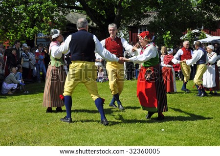 TORSTUNA, SWEDEN- JUNE 19:  Folklore ensemble of Sweden in traditional costume at midsummer day 19 June 2009 in Torstuna, Sweden