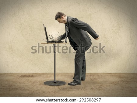 Businessman is Smashing to Computer