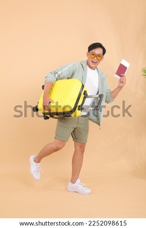 Similar – Image, Stock Photo Asian man with travel bag using smartphone against white wall