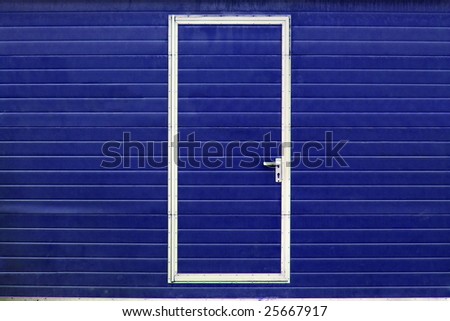 simple metal door in blue wall