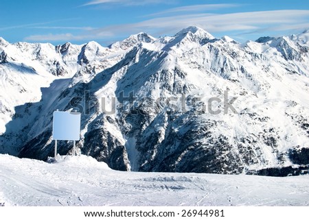 clear board in snowy Alps