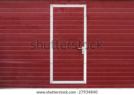 simple metal door in red wall