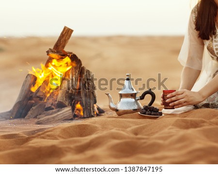 Image, Stock Photo Dates, teapot, cup with tea near the fire in the desert with a beautiful background