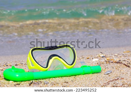 Mask for diving on a beautiful sandy sea beach, Diving mask for enjoying the sea, Photography