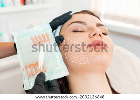 Facial lifting thread. Thread facelift with arrows on face for woman's skin, procedure facial contouring using mesothreads. Close up. Concept of plastic surgery. Stockfoto © 