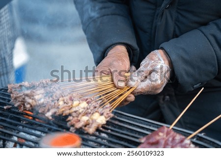 Similar – Image, Stock Photo Smoke oven with grate from which trout are suspended on a hook