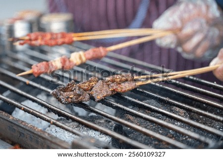 Similar – Image, Stock Photo Smoke oven with grate from which trout are suspended on a hook