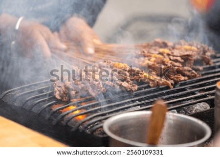 Similar – Image, Stock Photo Smoke oven with grate from which trout are suspended on a hook