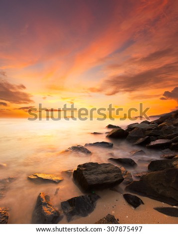 Beautiful scenery of sunset beach in Borneo.Image have warmer white balance to enhance the sunset color.