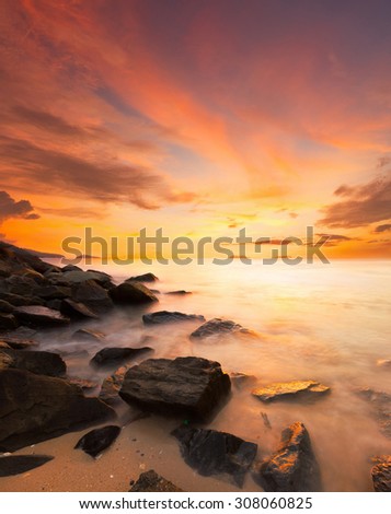 Beautiful scenery of sunset beach in Borneo. Image have soft color effect for fantasy look.Warmer color of sunset.