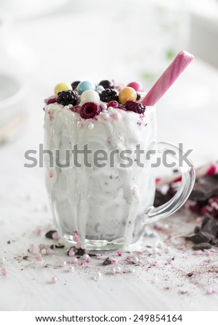 berry fruit natural ingredient milkshake and candy sprinkles