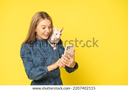 Similar – Image, Stock Photo Sphynx cat on shoulder of owner