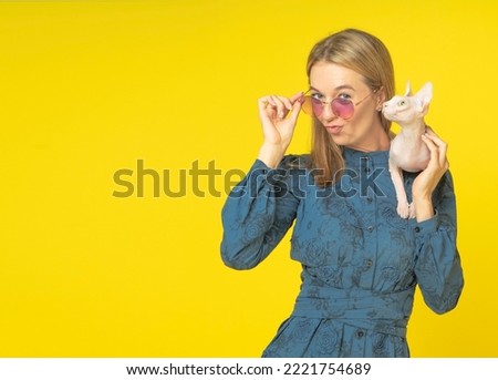 Similar – Image, Stock Photo Sphynx cat on shoulder of owner