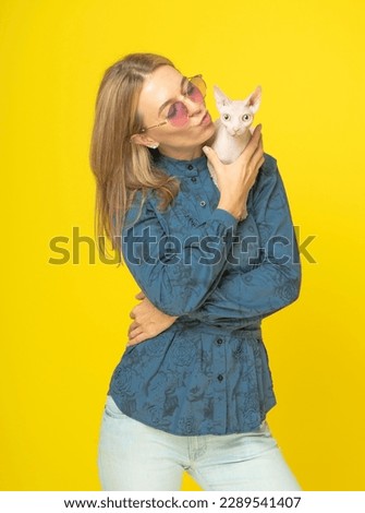 Similar – Image, Stock Photo Sphynx cat on shoulder of owner