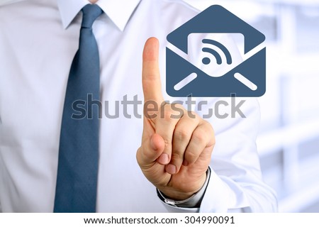 Business Man pushing on a touch screen interface. Email/letter behind