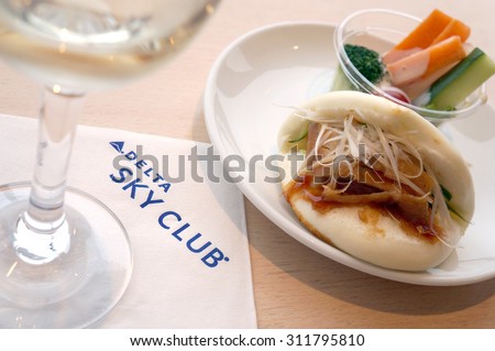 Narita, Japan - August 20, 2015: The meal and wine at Delta business class lounge in Narita Airport Terminal 1 on August 20, 2015. Delta airlines is the member of Skyteam alliance.
