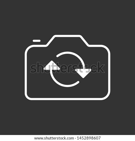 Flip camera icon isolated on dark background. Rotate camera symbol modern simple vector icon for website or mobile app