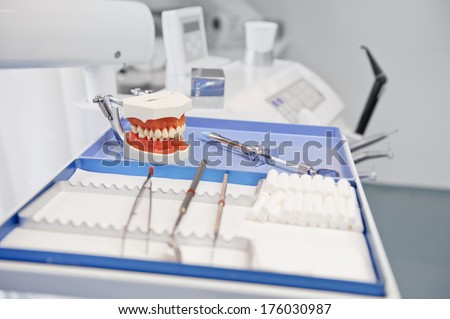 A tray holding dentistry tools including a mouth mold.