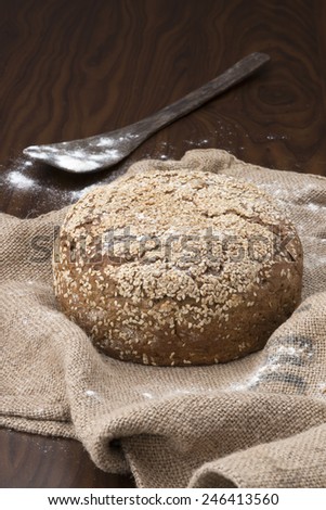 fresh baked bread on top of a jute bag