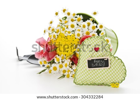 handmade heart with flowers and gardening tools on white background with a tag: Happy Birthday