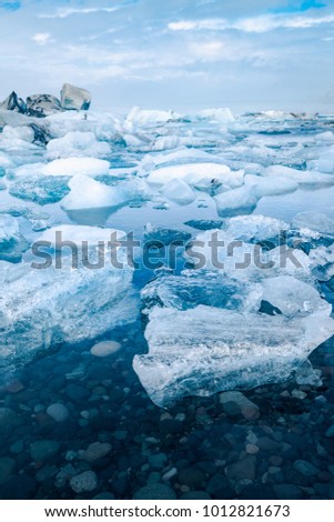Similar – Image, Stock Photo Glacier Lagoon with icebergs from above. Aerial View. Cracked Ice from drone view. Background texture concept.