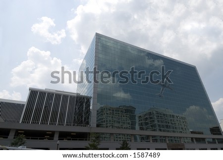 Big city office building towering from ground level. Architecture in the corporate world
