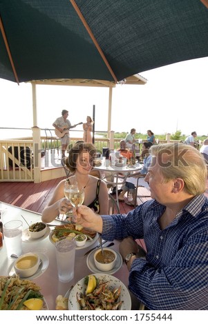 dining outside on the deck of a bayside restaurant