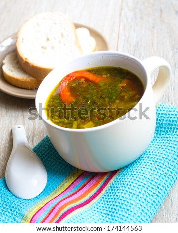Dinner time, vegetable soup with pepper on the table