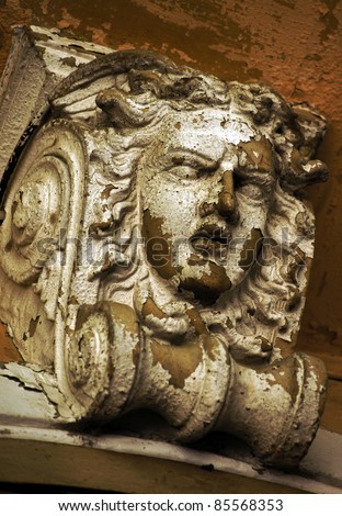 Gorgon mask on the old building facade in Tbilisi historical area, Georgia (country)