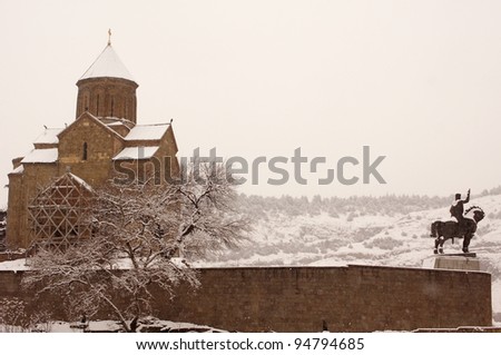 Winter view to covered with snow Tbilisi Old town in misty day
