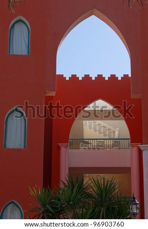 Arabic architecture: building with red and white walls