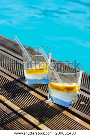 Gin and tonic cocktail on poolside bar