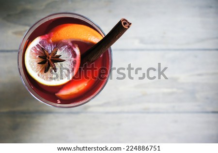 Mulled wine with spices on wooden background Сток-фото © 