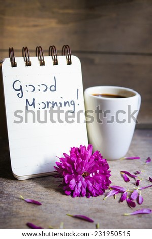Coffee time, autumnal flowers in a vase, cup of coffee and Good morning note