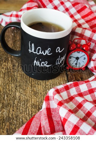 Tea time, mug of tea with lemon and chalkboard with Menu writting