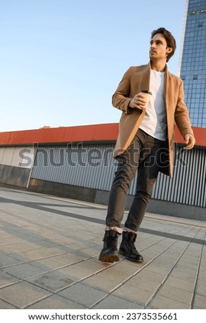 Similar – Image, Stock Photo Focused stylish man with suitcase and guitar gig bag on seaside