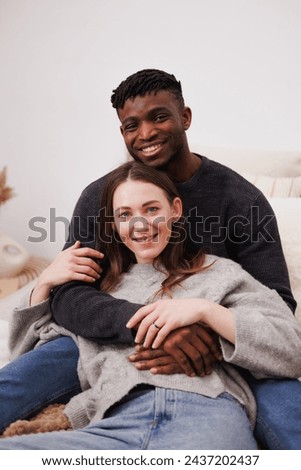 Similar – Image, Stock Photo Positive multiethnic couple embracing on street