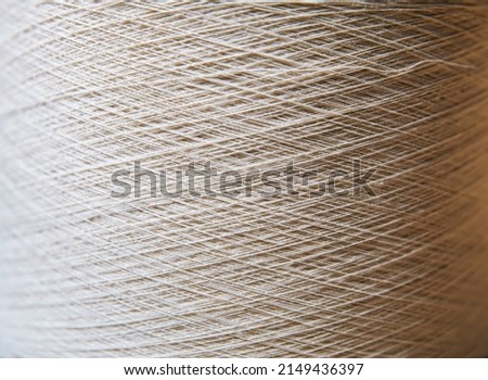 Similar – Image, Stock Photo Spooling up of yarn for knotting on a loom.