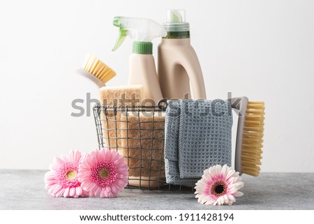 Brushes, sponges, cleaning cloth  and natural cleaning products in the basket.  Eco-friendly cleaning products. Spring freshness and purity concept 
