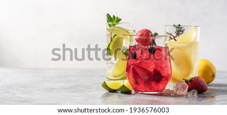 Set of multicolored summer drinks. Mojito, lemonade, berry, strawberry lemonade or cocktail with iced