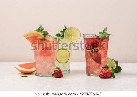 Similar – Foto Bild Grapefruitgetränk auf blauem Hintergrund. Frische Grapefruitscheiben