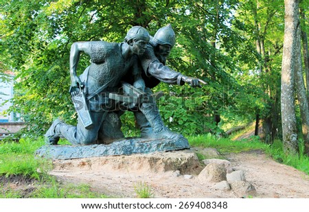 TARTU, ESTONIA - JULY 07, 2014: Two wikings bronze sculpture in Tartu, Estonia.