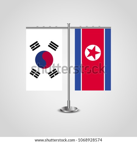Table stand with flags of South Korea and North Korea.Two flag. Flag pole. Symbolizing the cooperation between the two countries. Table flags